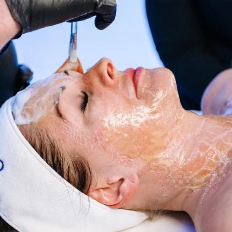 Firming facial treatment applied in a professional skincare setting